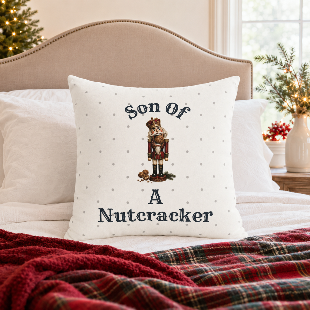 Funny Son of a Nutcracker Christmas pillow cover featuring a classic red and gold nutcracker soldier on ivory. Festive holiday decor and gift idea.