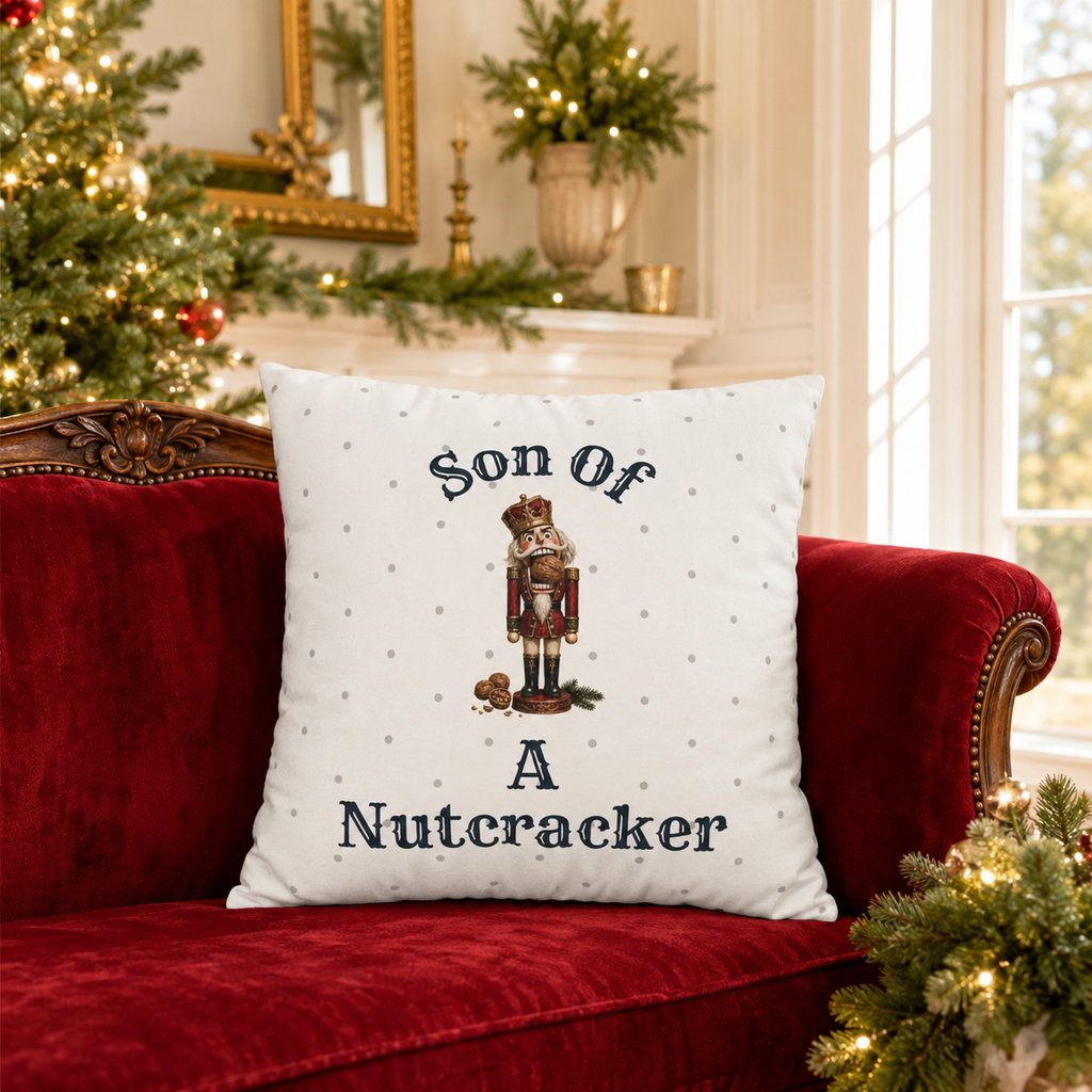 Funny Son of a Nutcracker Christmas pillow cover featuring a classic red and gold nutcracker soldier on ivory. Festive holiday decor and gift idea.