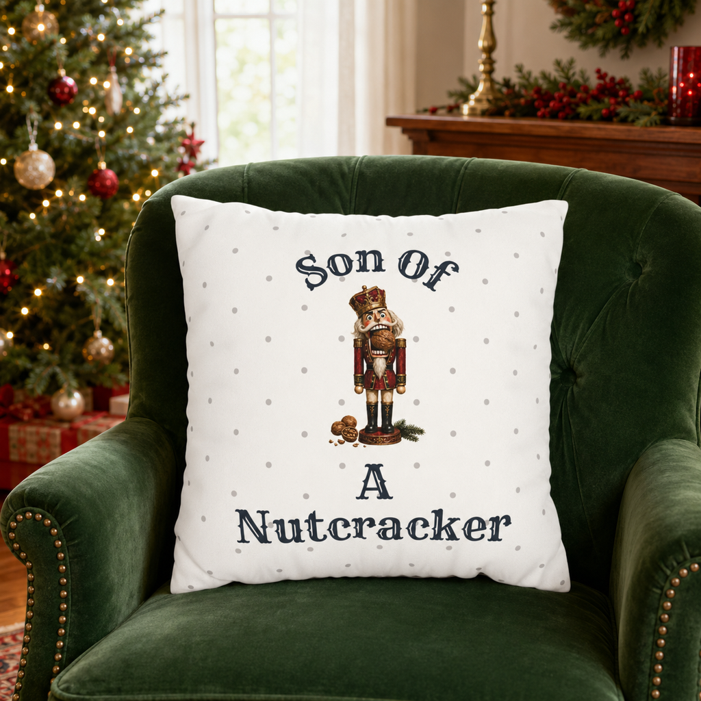 Funny Son of a Nutcracker Christmas pillow cover featuring a classic red and gold nutcracker soldier on ivory. Festive holiday decor and gift idea.