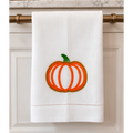 White 14 by 22 linen kitchen towel with textured orange and golden embroidered pumpkin, green stem and decorative hemstitch border.